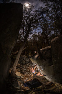 Rosalyn Blake boulders during an evening session at the North Black Range Bouldering Festival
