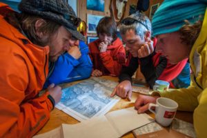 Route planning with the guides and heli-pilots before the flights.